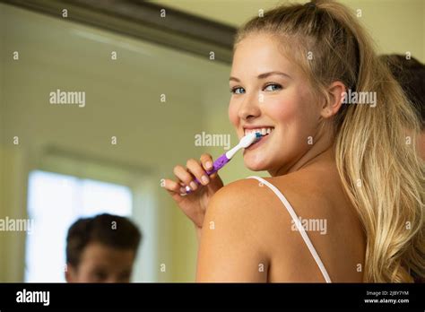 Portrait Of Young Woman In Bathroom Getting Ready In The Morning With