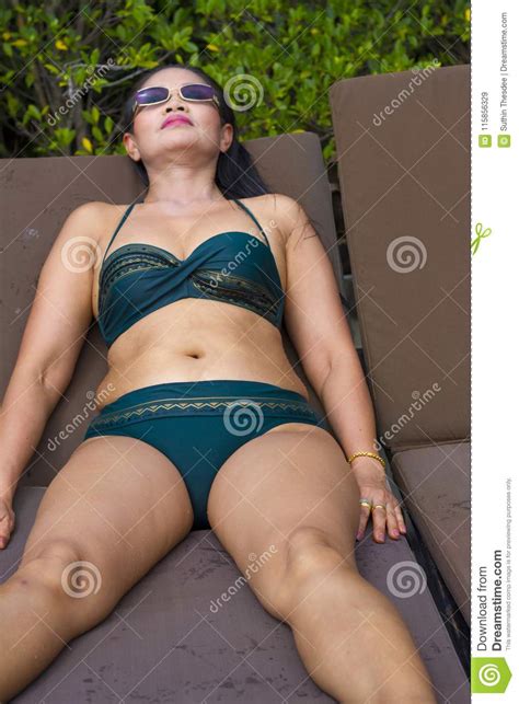 Woman Shape Sex Symbol With Bikini In Swimming Pool Stock