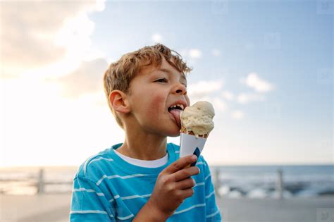 boy eating  ice cream stock photo  youworkforthem