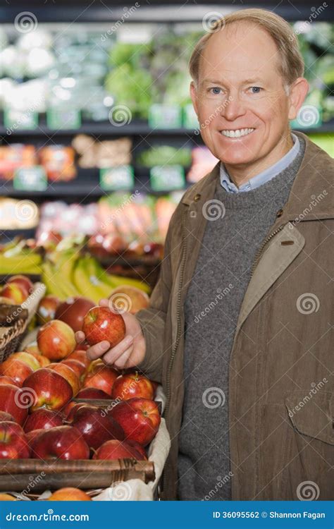 man holding  apple stock photo image   adults