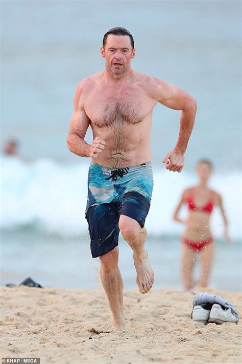 hugh jackman 50 flaunts rippling muscles and washboard stomach on