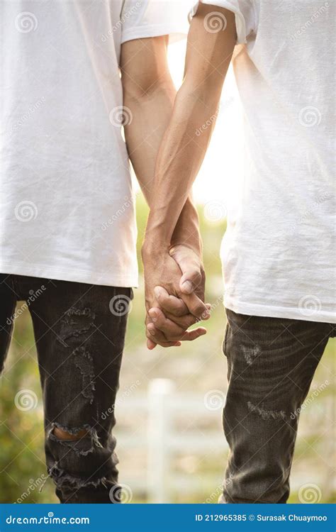 Happy Gay Couple Holding Hands At Sunset Love And Together Concept