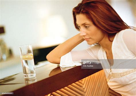 Woman Sitting At Bar Photo Getty Images