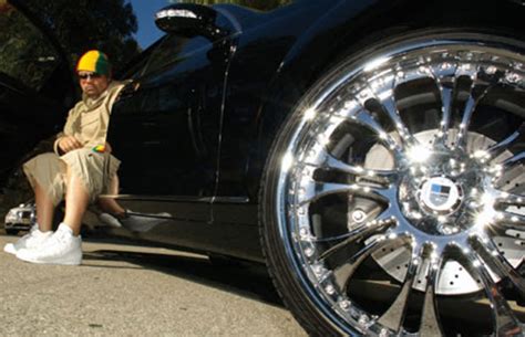 nelly 30 photos of rappers flexing with giant car rims complex
