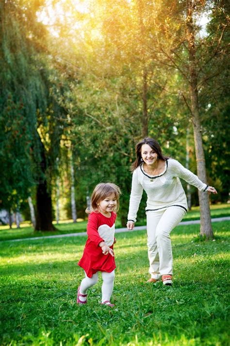 Mom Plays With Her Daughter Stock Image Colourbox