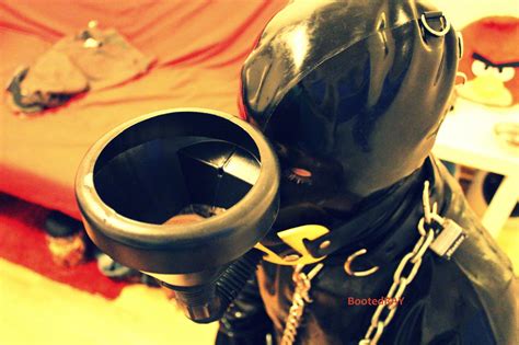 red bondage rubber slave in training bootedray