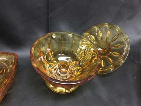 Lot 2 Amber Glass Dishes With Lids Bodnarus Auctioneering