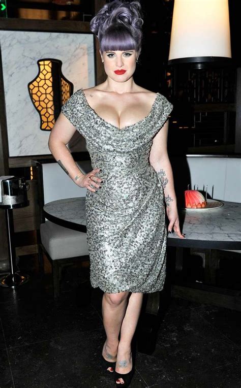 and breathe in busty kelly osbourne s cleavage pops out in plunging