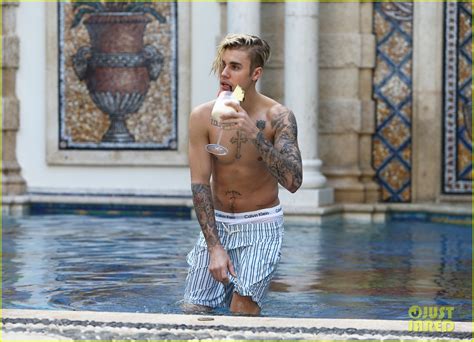justin bieber goes shirtless for a swim at the versace mansion photo 3528495 justin bieber
