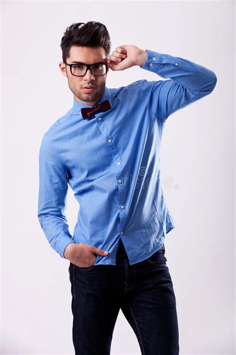Male Model Wearing Bow Tie And Holding His Glasses Stock