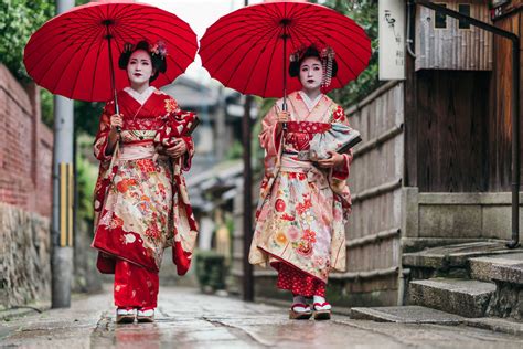 maiko geisha walking on a street of gion in kyoto japan travel off path