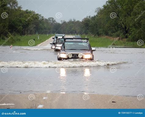 cars crossing  flooded river stock image image  season cars