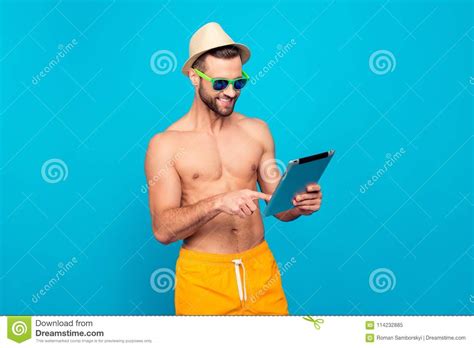portrait of modern cheerful attractive man with naked torso in stock