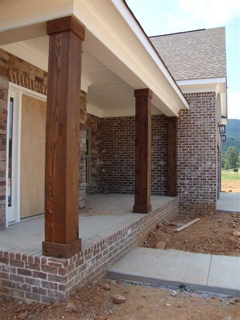 home building project cedar columns lighting  stained stairs