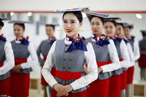 chinese flight attendants practise graceful grin   chopstick