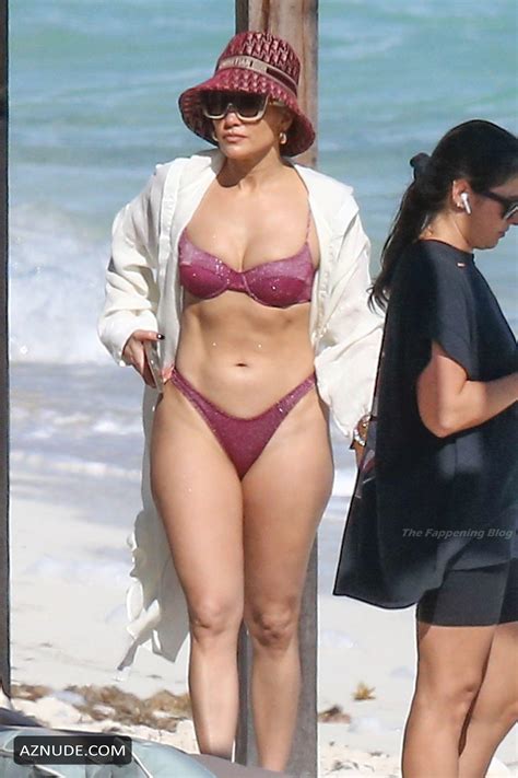 jennifer lopez sexy looking hot in a purple bikini on the beach in