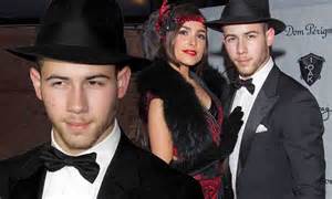 nick jonas and olivia culpo coordinate as 1920s gangsters for halloween in sin city daily mail