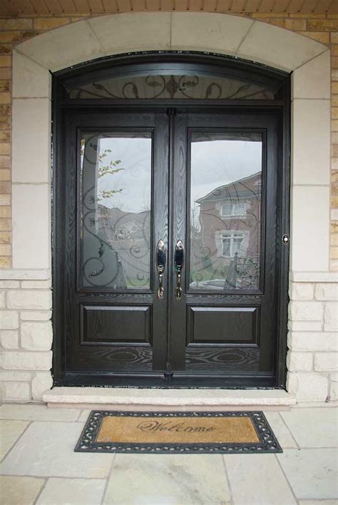 woodgrain fiberglass doors iron art glass design front door  nice matching arch transom