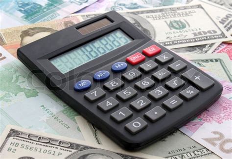 calculating cash calculator  stock image colourbox