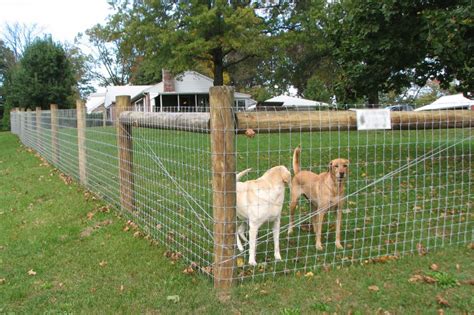 woven wire fence installation  ranch house  acreage dog yard
