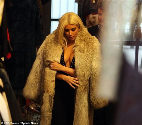 kim kardashian peels off fur coat to reveal sideboob during paris