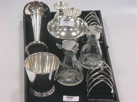 collection  silverware including egg cups toast racks  small tankard  sugar bowl