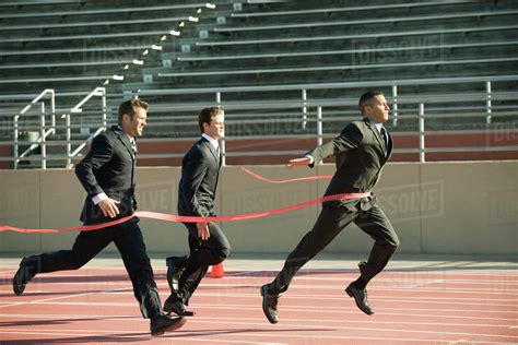 businessman crossing finish   race stock photo dissolve