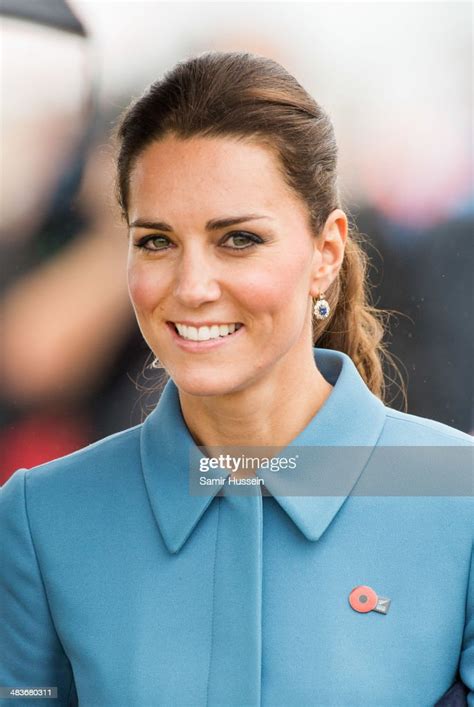 catherine duchess of cambridge smiles as she attends a ww1