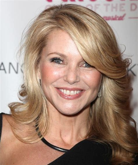 christie brinkley long wavy golden blonde hairstyle with