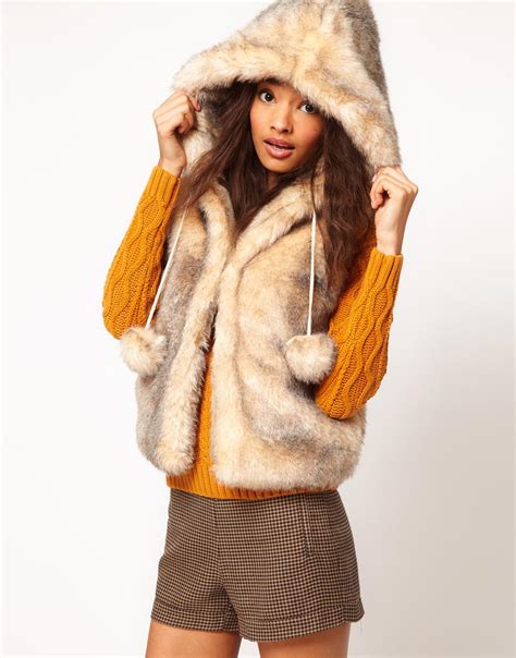 lyst asos collection asos hooded gilet  pom poms  natural