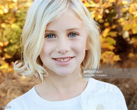 close up of blond girl with big blue eyes stock foto getty images