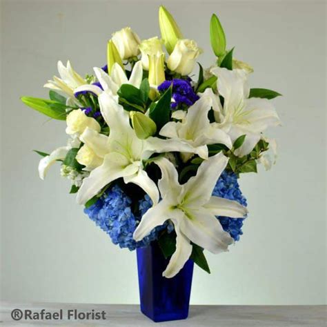 Blue And White Flower Arrangement With Hydrangeas And Lilies White