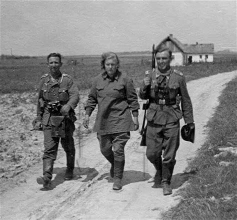 two german soldiers with captured women soviet soldier