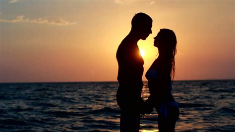 couple silhouette beach sunset light stock footage video 100 royalty