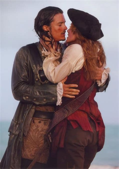 Two People Dressed As Pirates Kissing Each Other