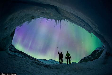 aurora borealis lights up the night sky behind glacier climbers daily mail online
