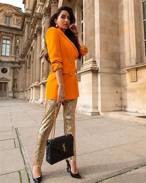 Nora Fatehi Flaunts Curves In Orange Bodycon Dress See The Divas