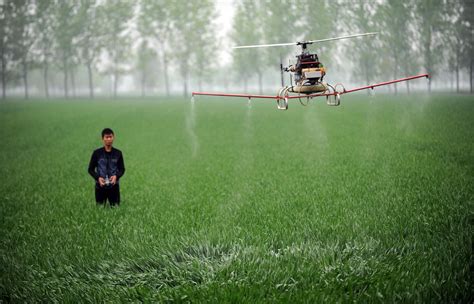 high tech farmer deploys drone  spray crops nbc news