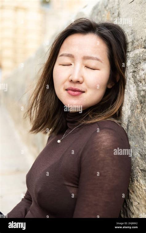 portrait of an attractive 29 year old asian american girl standing