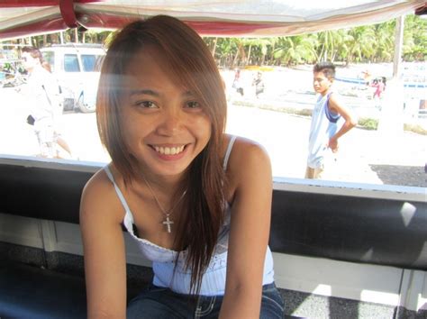 cute filipina girl on boracay beach philippines present