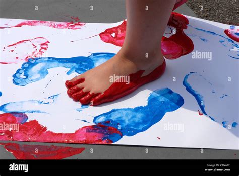 nursery child painting footprints  walking  paint  bare feet stock photo alamy