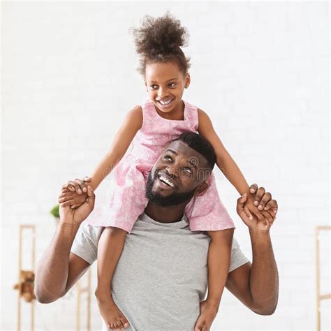 smiling black dad and daughter spending time together stock image