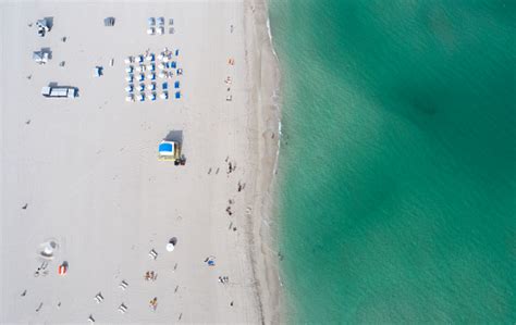 miami south beach overhead aerial view white sand green water stock