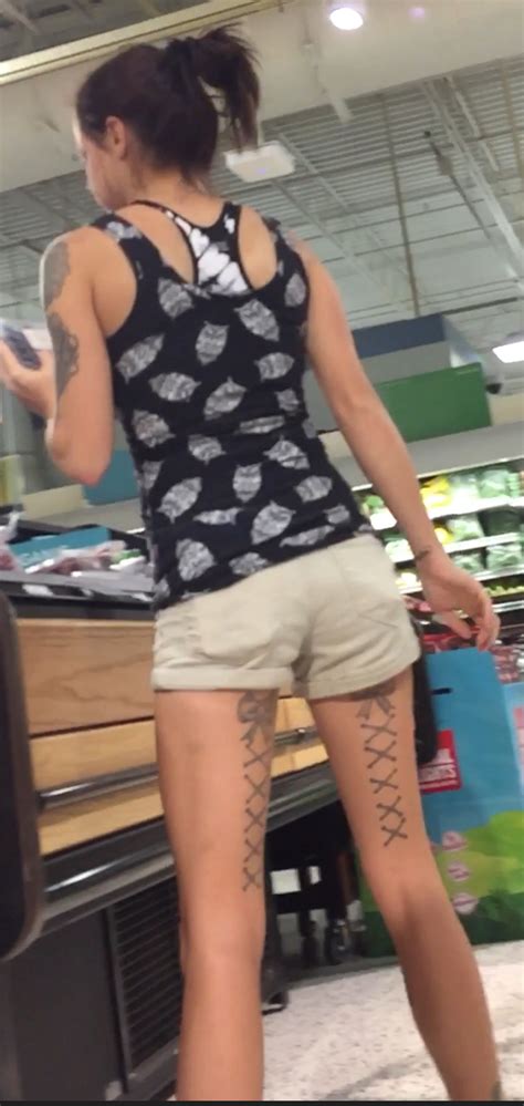 Skinny Girl With Leg Tats At The Market Short Shorts