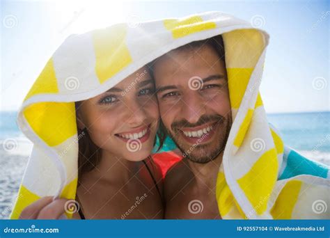 portrait  happy couple  towel  sunny day stock photo image