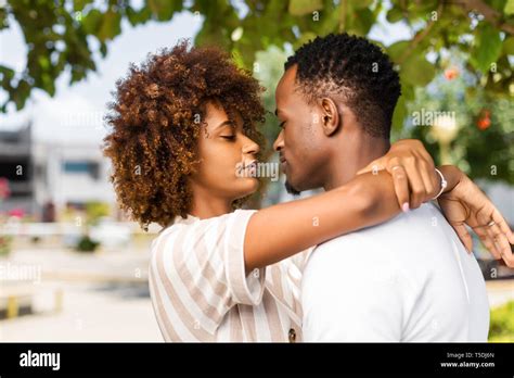 Outdoor Protrait Of Black African American Couple Kissing Each Other