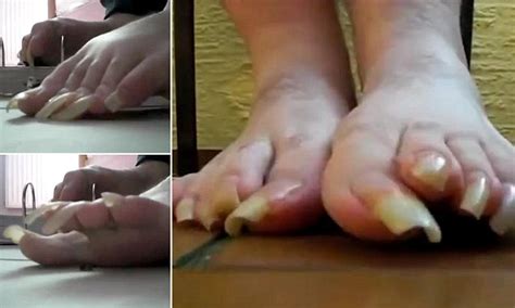 woman with long toenails claws the ground to make a spine chilling