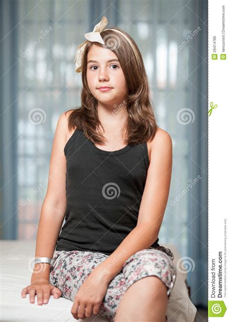 image of pretty teenager posing indoor in a good mood