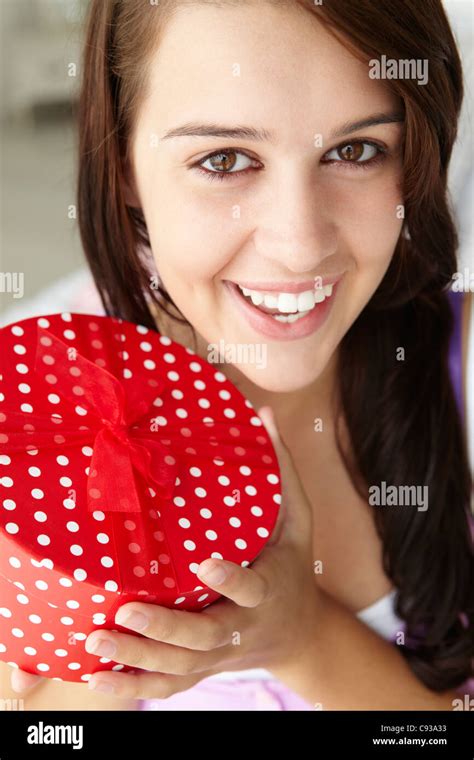 teenage girl holding gift box stock photo alamy