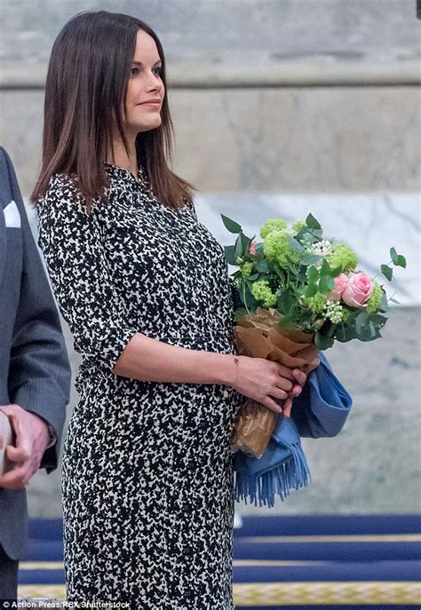Pregnant Princess Sofia Of Sweden Holds A Bouquet Of Flowers Over Her